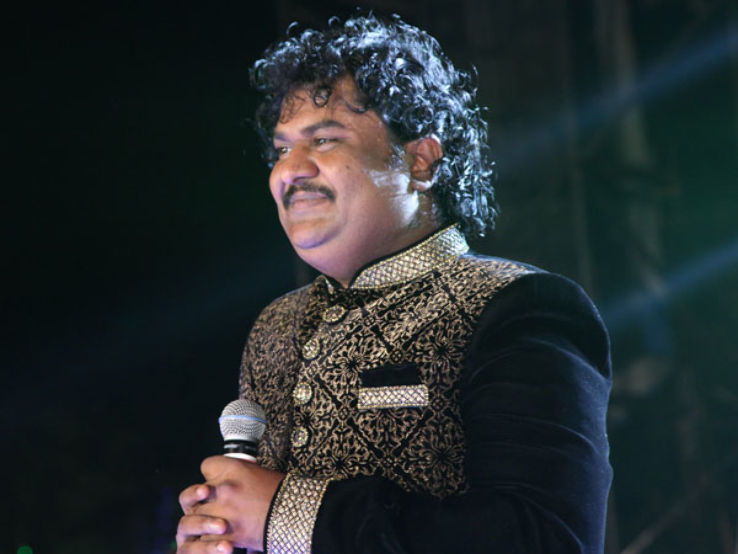 Osman Mir receiving recognition for musical excellence